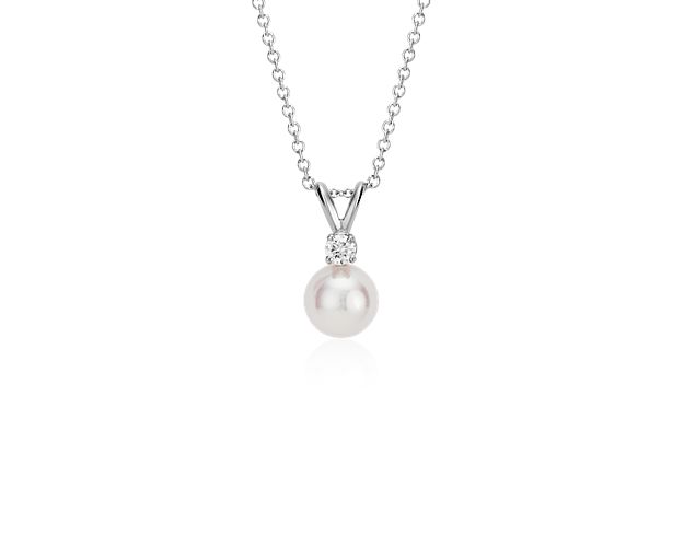 Our highest-quality Akoya cultured pearl is paired with a brilliant round diamond and attached to an 18k white gold bail. The pair suspend from a delicate 18k white gold 16" cable chain.