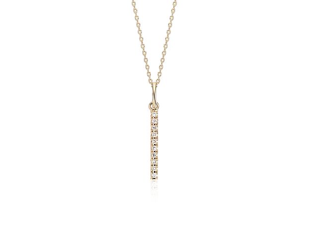 Chic and sparkling, this diamond pendant features pavé-set round diamonds in a bar design of 14k yellow gold, and a matching cable chain. This pendant can be worn at 16 or 18 inches in length.