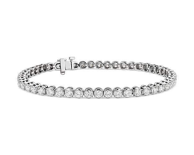 Brilliance defined, this diamond tennis bracelet features brilliant cut round diamonds set in a four-prong straight line design framed in enduring platinum.