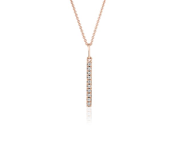 Chic and sparkling, this diamond pendant features pavé-set round diamonds in a bar design of 14k rose gold, and a matching cable chain. This pendant can be worn at 16 or 18 inches in length.