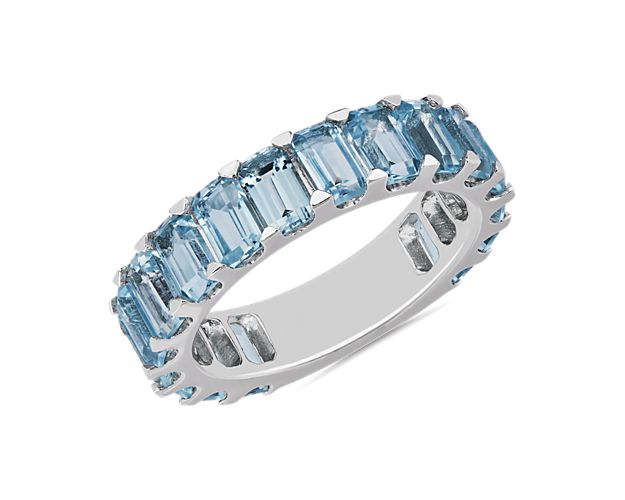 Perfect for big moments and every day after, this sterling silver eternity band sparkles with an unbroken string of octagon-shaped sky blue topaz for a vibrant style that commands any ring stack.