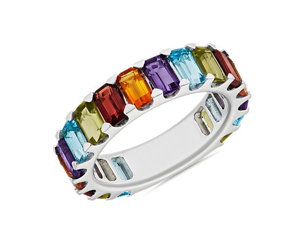 Perfect for big moments and every day after, this sterling silver eternity band sparkles with an unbroken string of octagon-shaped rainbow gemstones for a vibrant style that commands any ring stack.