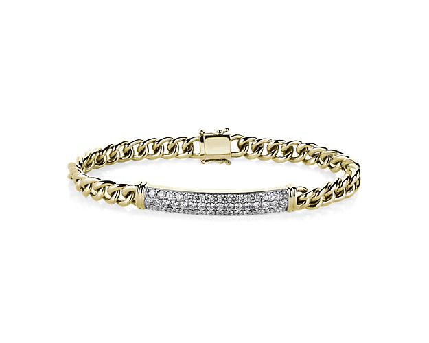 This handsome link bracelet features beautifully crafted 14k yellow gold design for a weighty, comfortable feel. A diamond bar accent gives it luxurious shimmer and elevates the look.