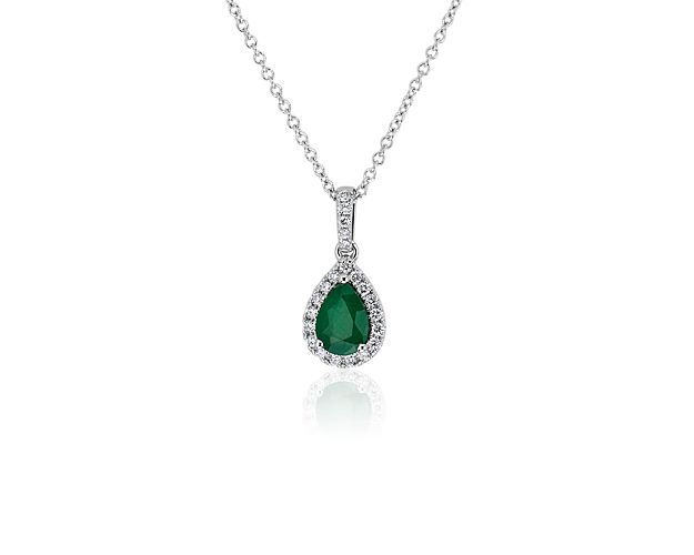 Go for a luxurious look when you wear this pendant crafted from lustrous white gold and featuring a pear-cut emerald at its heart. Shimmering diamonds sparkle in a halo around the green stone, and add brilliance to the bale.