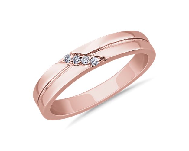 Bright diamonds are set in a beautifully angled diagonal along the front of this ring. It is crafted from luxurious 14k rose gold that promises an enduring gleam.