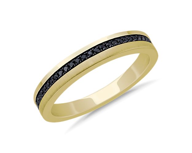 Subtle in brilliance, this wedding ring is crafted in enduring 14k yellow gold featuring a center band of round black diamonds.