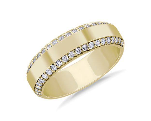 This wedding band is accented with a row of diamonds along each of its two edges, while polished 14k yellow gold makes it ideal for extended wear.