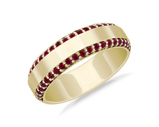 This wedding band is accented with a row of rubies along each of its two edges, while polished 14k yellow gold makes it ideal for extended wear.