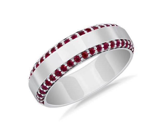 This wedding band is accented with a row of rubies along each of its two edges, while polished platinum makes it ideal for extended wear.