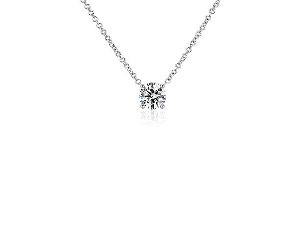 Timelessly elegant in its simplicity, this pendant features a floating lab-grown diamond style setting that makes the single solitaire  a breathtaking statement. The 14k white gold setting complements the stone with its cool lustre.