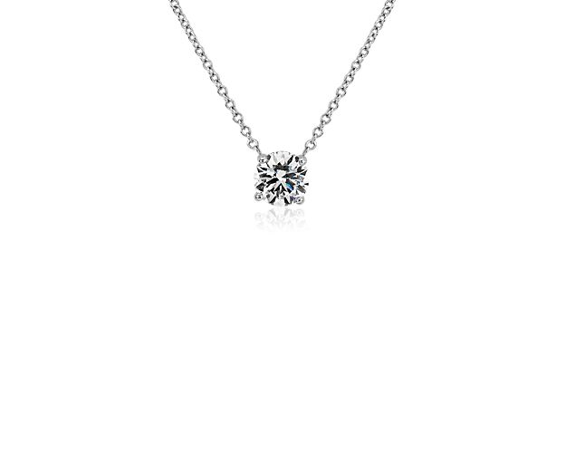 Go for classic allure when you wear this gorgeously simple pendant featuring a graceful floating lab-grown diamond style setting that maximizes the sparkle of the stone. The 14k white gold design delivers lasting quality and beautiful lustre.