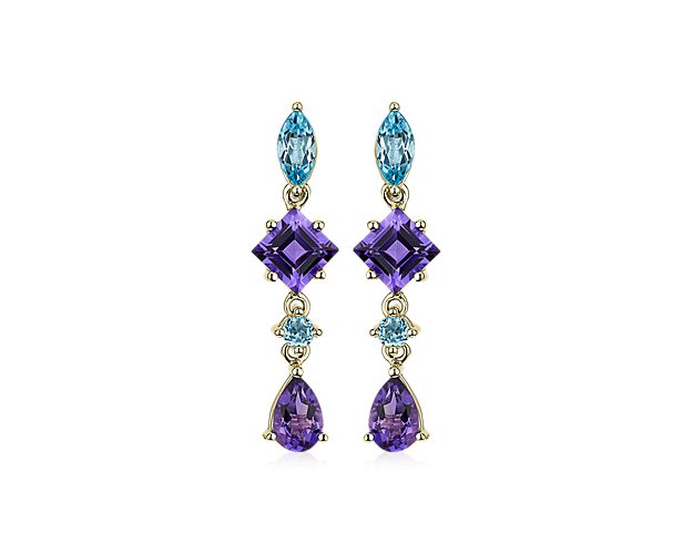 Blue topaz and amethyst stones in an array of cuts alternate in gorgeous style, dangling delicately in each of these drop earrings.  They feature warmly gleaming 14k yellow gold design to complement the rich tones of the stones.