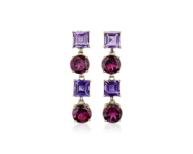 Round-cut rhodolite stones alternate with princess-cut amethysts for a stunning effect from these graceful drop earrings. The deep, rich colours in the stones match beautifully with the warm gleam of the 14k yellow gold design.
