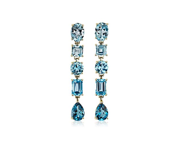 Summon their attention when you wear these stunning drop earrings featuring mixed blue topaz stones in a variety of cuts dangling gracefully. The 14k yellow gold design gives it a look of gorgeous contrast and classic luxury.