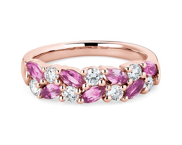 Elegant and unique, this stunning ring features marquise-cut pink sapphires and round-cut diamonds set in a dazzling array along the front of the band. The cool gleam of the 14k rose gold completes the luxurious design.