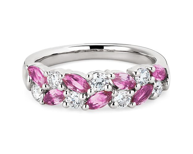 Elegant and unique, this stunning ring features marquise-cut pink sapphires and round-cut diamonds set in a dazzling array along the front of the band. The cool gleam of the 14k white gold completes the luxurious design.