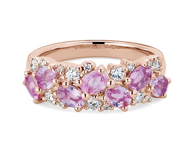 Oval-cut pink sapphires sparkle together with brilliant round-cut diamonds in this breath-taking ring. It is artfully design in lustrous 14k rose gold for a look of timeless luxury.