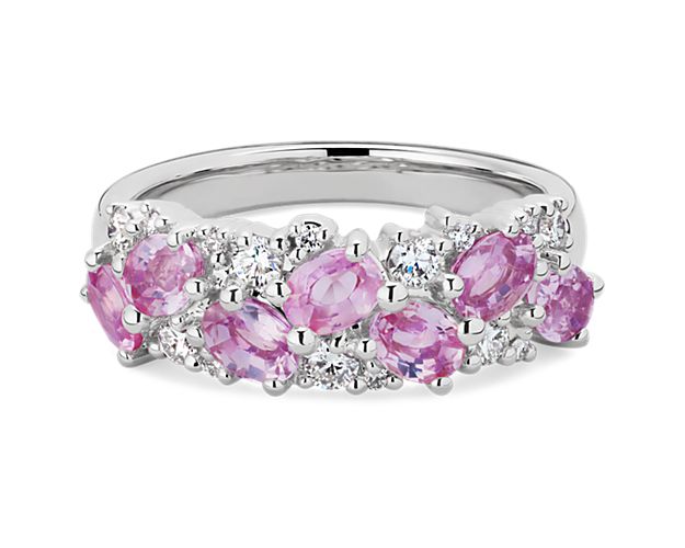 Oval-cut pink sapphires sparkle together with brilliant round-cut diamonds in this breath-taking ring. It is artfully design in lustrous 14k white gold for a look of timeless luxury.
