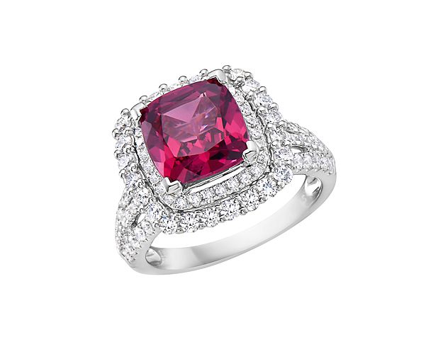 Pretty in pink, yes please! This ring features a stunning pink rhodolite center stone surrounded by a double diamond halo and diamond detailing down the shank. Set in luxurious 18k white gold, this ring is perfect for your next gift or self purchase.