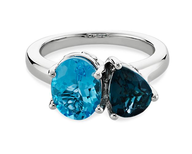 Elegantly gorgeous, this two stone ring features an oval-cut Swiss blue topaz in symphony with a pear-cut Blue Topaz stone. The beautiful 14k white gold design promises a bright lustre that lasts.