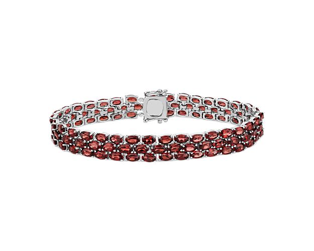 Show your true color with this garnet bracelet crafted in sterling silver featuring more than 90 oval garnet gemstones in a flexible triple line design.