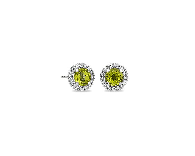The must-have, go-to pair your ear stack has been craving, these 14k white gold stud earrings sparkle with brilliant diamond halos that command the moment as they encircle meticulously matched round peridot stones.