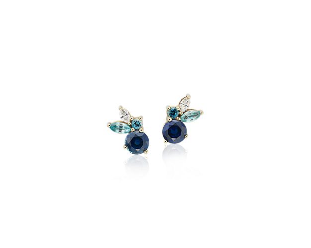 Crafted in 14k yellow gold, these unique stud earrings feature round vibrant sapphires and aquamarines, paired with marquise-shaped zircon gemstones and diamonds.