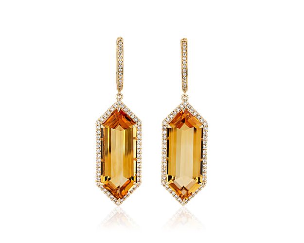 Hexagon-cut citrine stones give these drop earrings a gorgeous art-deco-inspired style, while diamond halos lend them luxurious sparkle. The 14k yellow gold design gives them a warm lustre to match the rich tones of the citrine.