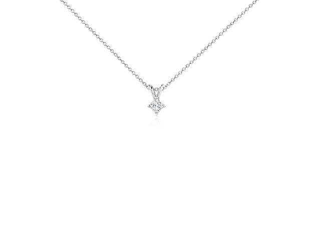 A near-colorless princess cut diamond is secured at the corners by 14k white gold prongs. A 14k white gold bail suspends the pendant from an 14k white gold cable-link chain. 1/4 carat total diamond weight.