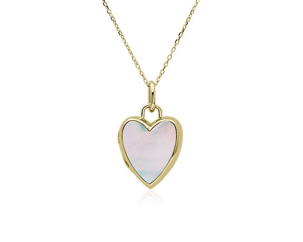 A slice of lustrous mother-of-pearl gleams from the center of this heart-shaped locket. It is beautifully crafted from 18k yellow gold featuring a warm luster.