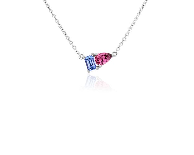 Add a touch of sparkle to your style with this gorgeous two stone pendant necklace featuring an emerald-cut tanzanite stone paired with a pear-cut pink tourmaline. It is designed in gleaming 14k white gold for enduring quality.