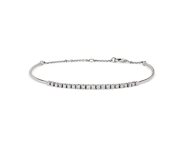 Lend luxurious shimmer to your wrist with this elegant bracelet featuring a row of diamonds sparkling along the front-facing edge. The bright gleam of the 14k white gold design beautifully complements the brilliant stones.