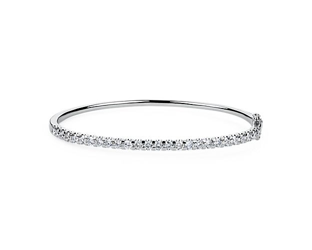 Elegant and simply timelessly, this bangle features a front edge set with a stunning 2 ct. tw. of diamonds for breath-taking shimmer. The lustrous 14 white gold design promises enduring quality and luxury.