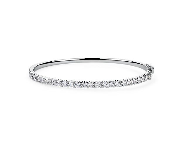 Complete your look with dramatic sparkle as you slip on this stunning bangle featuring 3 ct. tw. in diamonds shimmering along its front edge. It is designed in gleaming 14k white gold to finish the luxurious look.