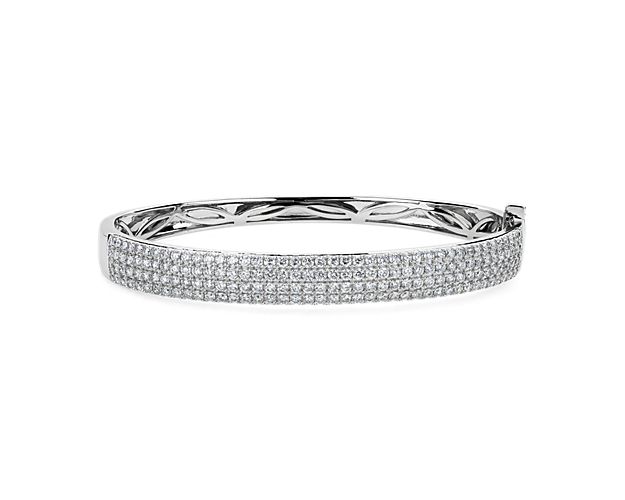 Opt for luxurious shimmer with this bangle featuring multiple rows of stunning diamonds for a total of 3 1/6 ct. tw. sparkling along the front edge. It is beautifully designed in lustrous 14k white gold and features hidden elegant detailing along the inside. Dimensions are 62mm x 52mm.