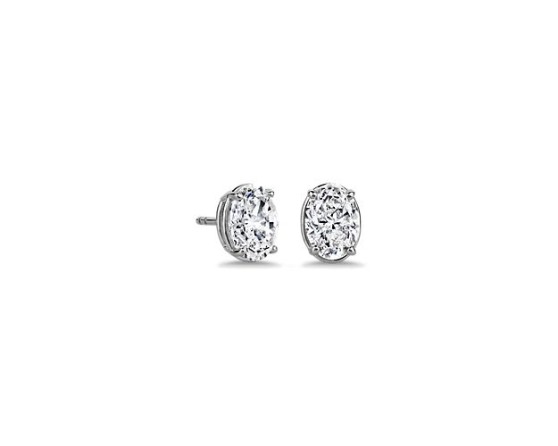 A single oval-cut diamond sparkles beautifully in each of these timelessly simple and stunning stud earrings. They are designed in gleaming 14k white gold to ensure enduring luxurious quality.