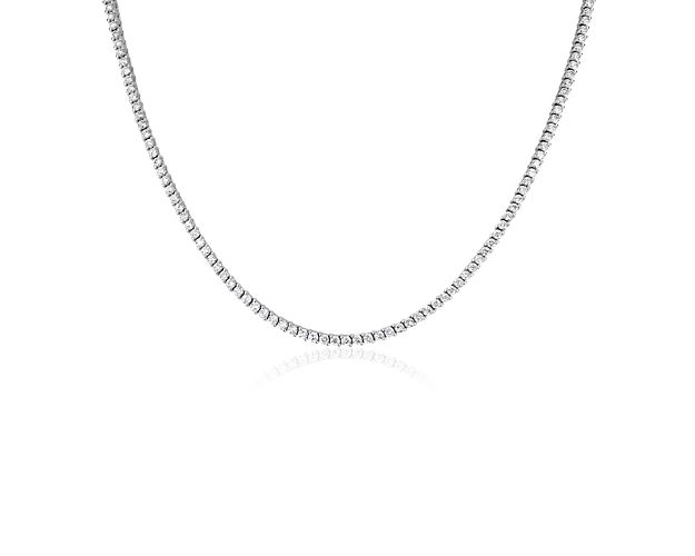 Stunning round-cut diamonds sparkle in an endless loop along this eternity necklace, adding brilliance to your look. It is designed in luxurious 14k white gold and features unique two-prong settings to highlight the stones.