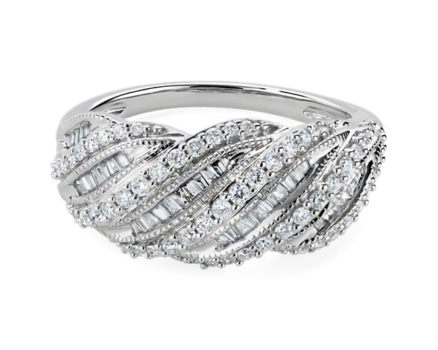 Capture the eye when you wear this stunning ring featuring an elegantly twisting design with multiple rows of delicate diamonds shimmering in the light. The cooly lustrous 14k white gold design complements the stones beautifully with luxurious quality.