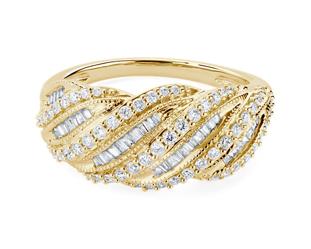 Mesmerizing diamonds shimmer in an array of twisting rows in this beautifully unique ring. The warm gleam of the lustrous 14k yellow gold design gives it a classic look of luxury.
