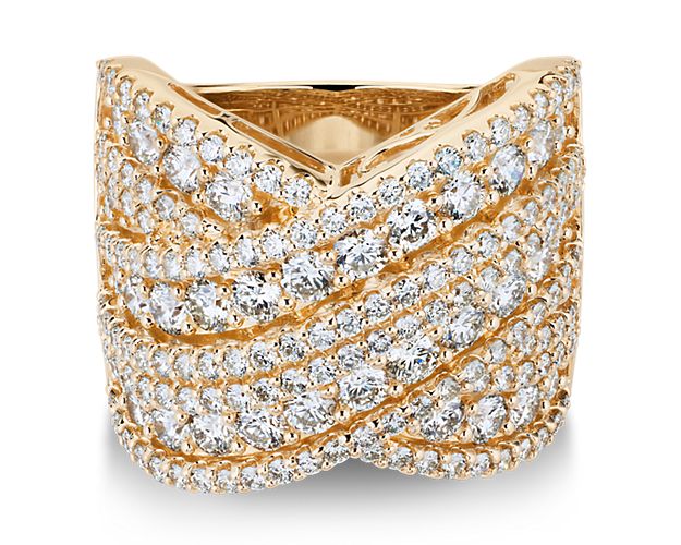 Take their breath away when you wear this stunning ring crafted in gleaming 14k yellow gold, and defined by an elegant twisting crossover design. Multiple rows of delicate diamonds add mesmerizing shimmer as it catches the light.