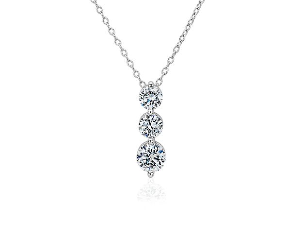 Diamond pendant featuring three lab grown diamonds in graduating sizes. 