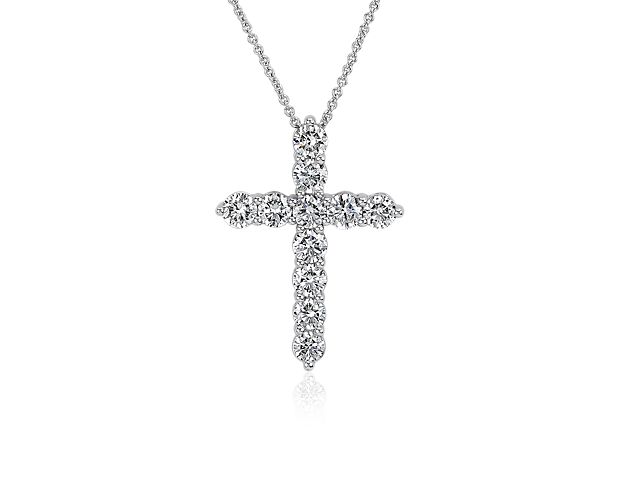 Gorgeous lab grown diamonds sparkle along the arms of this elegant cross necklace, adding bold sparkle to your style. It is crafted in 14k white gold that promises a cool lustre and luxurious quality.