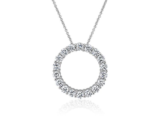 White gold pendant necklace featuring a circle of lab grown diamonds.