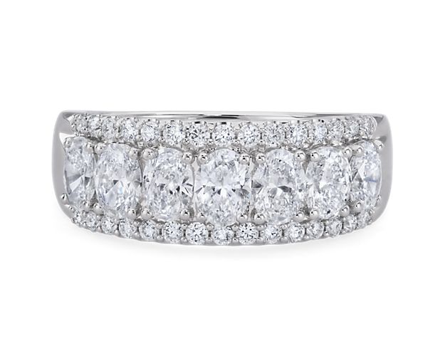 Elegant and breathtaking, this ring features oval lab-grown diamonds sparkling along its center.