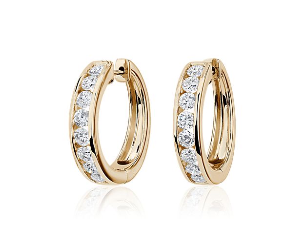 Yellow gold hoop earrings with lab diamonds.