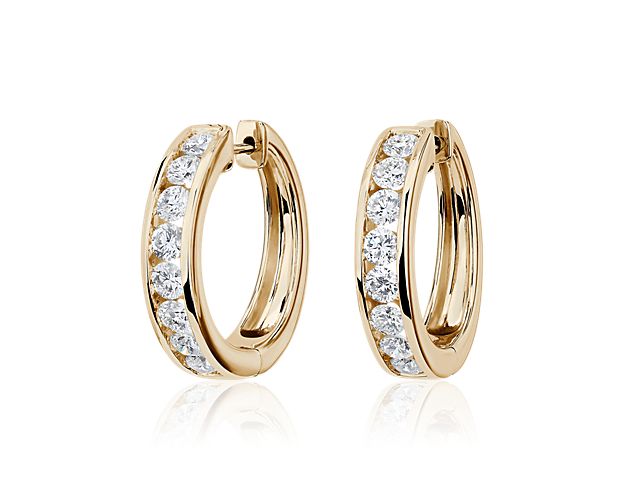 Sparkle as you catch the light wearing these eternity hoops set with brilliant lab-grown diamonds. They feature timeless design in lustrous 14k white gold that promises lasting luxury.