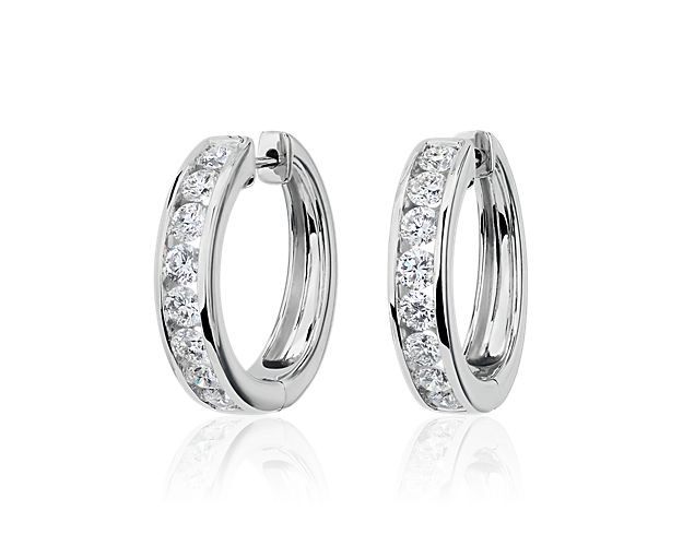 Sparkle as you catch the light wearing these eternity hoops set with brilliant lab-grown diamonds. They feature timeless design in lustrous 14k white gold that promises lasting luxury.
