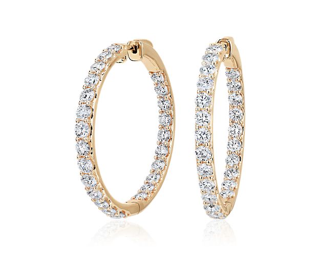 Embody elegance as you sparkle wearing these eternity hoop earrings featuring stunning lab grown diamonds shimmering along the front-facing edges. The 14k white gold design promises enduring quality and lovely lustre.