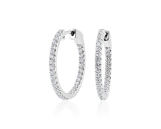 Lab grown diamond eternity hoop earrings in white gold. 