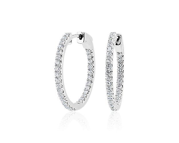 Bring elegant sparkle to your style with these timeless eternity hoop earrings featuring stunning lab grown diamonds shimmering along the front-facing edges. They feature 14k white gold design with a cool lustre that beautifully completes the look.